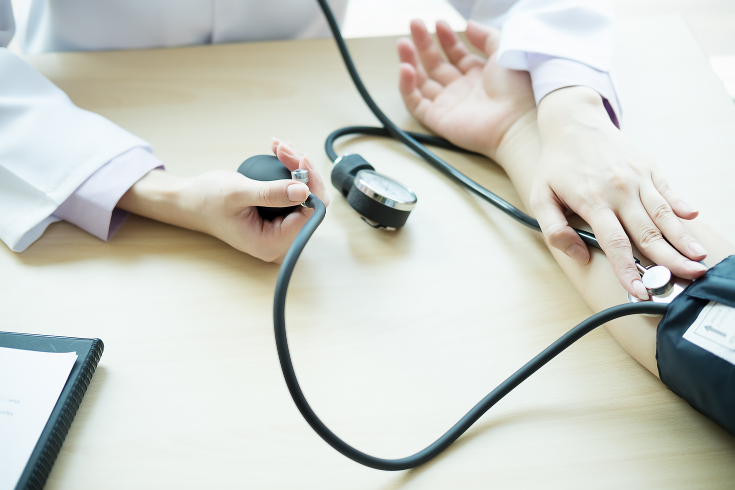 Doctor Measuring Patient Arterial Blood Pressure. Health Care,Ho